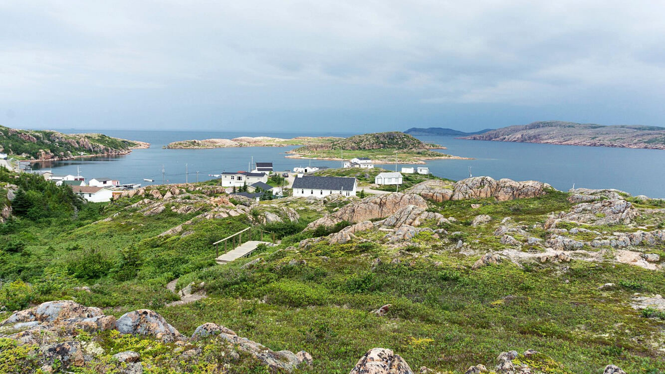 view of a rocky coastal town from a lookout