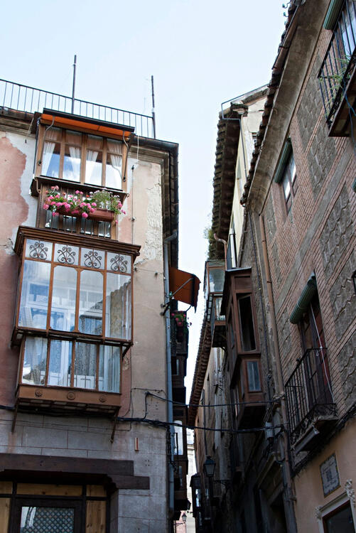 historical Spanish building with protruding enclosed balconies