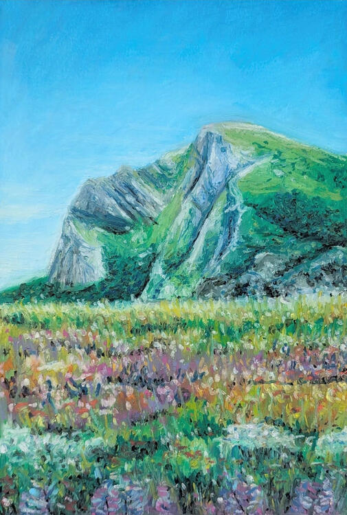 oil pastel painting of a green and grey mountain behind a colourful meadow on a clear day